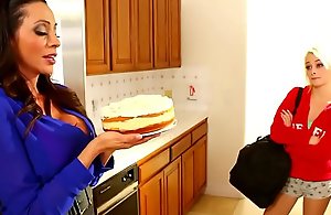 Lesbian mamma and daughter have cake