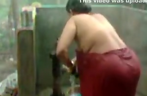 big beautiful non-specific indian bhabhi taking shower from pump
