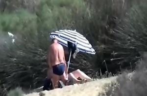 Pervert granny masturbates forward stranger at beach